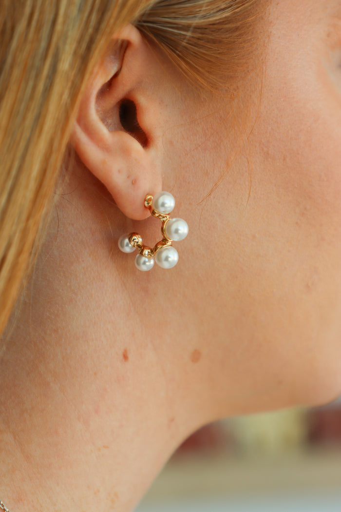 gold and pearl hoop earring