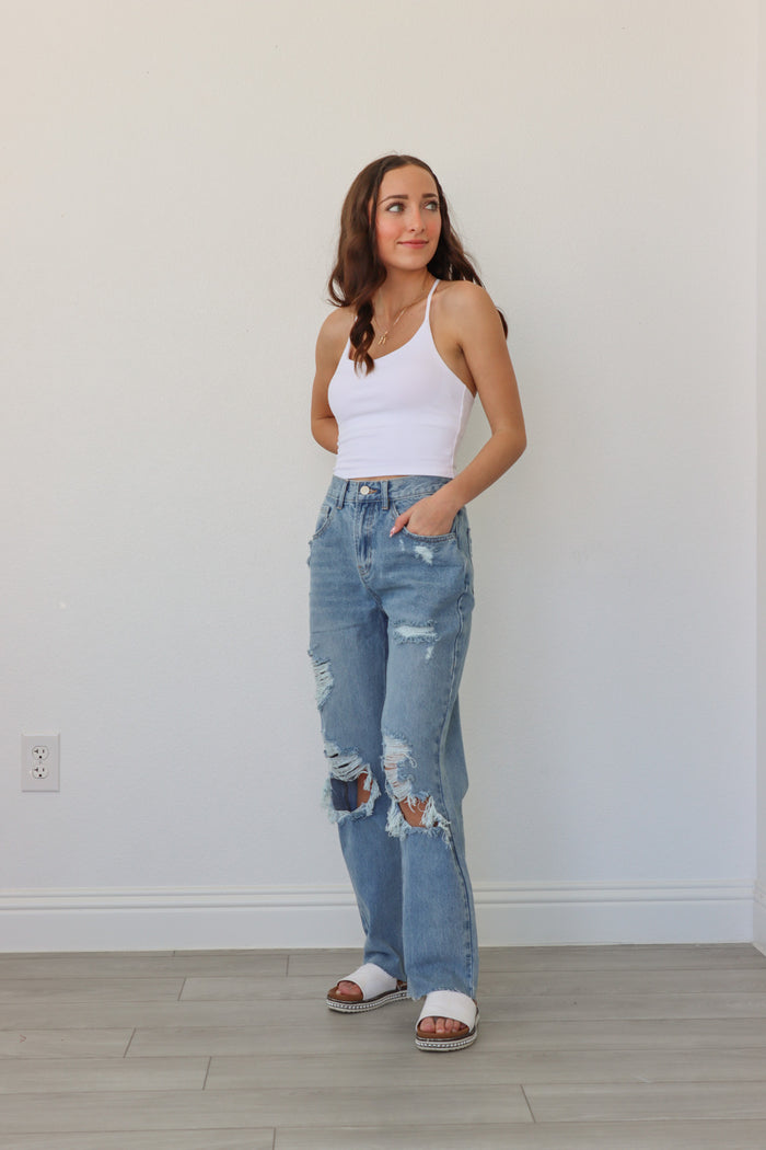girl wearing blue ripped jeans