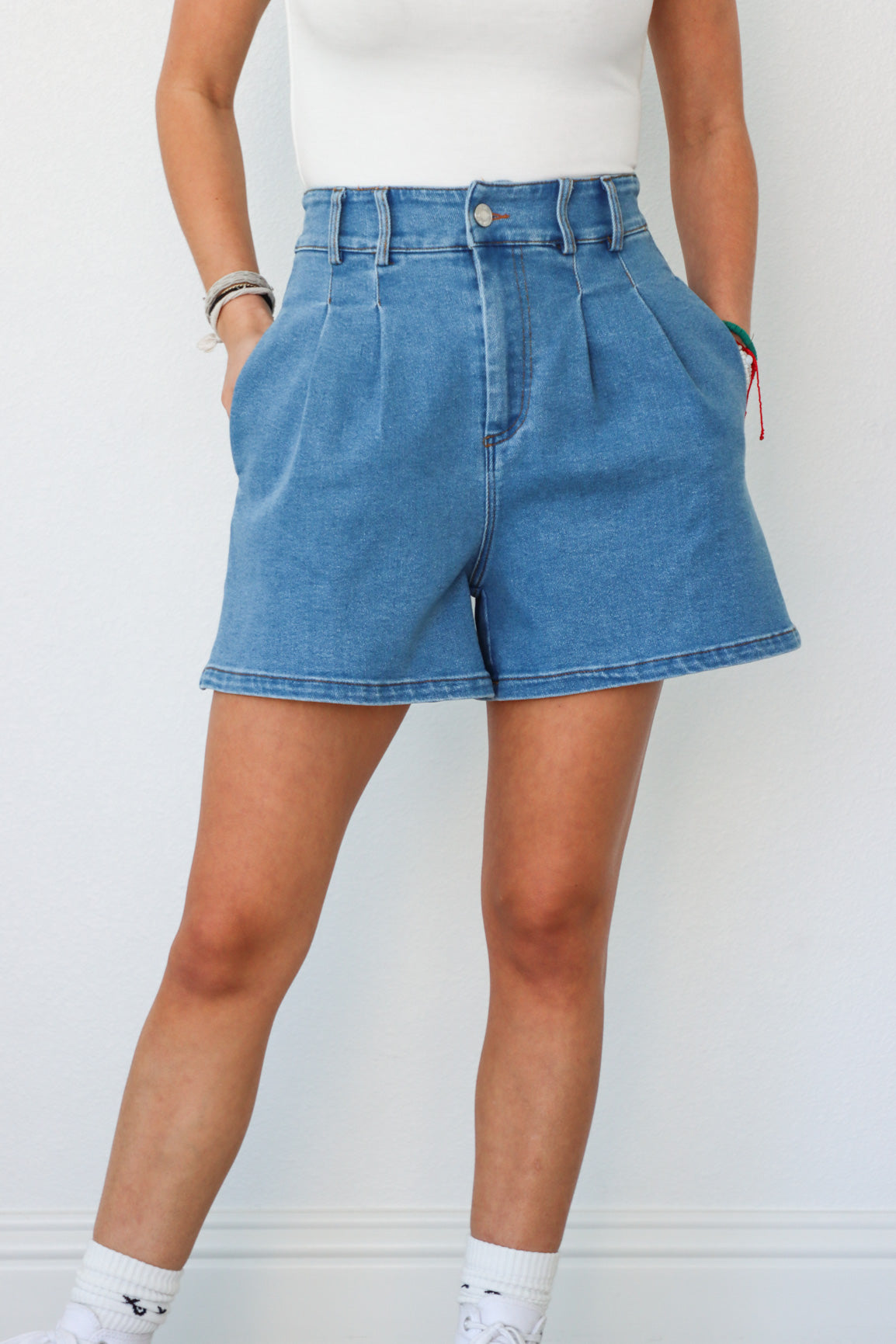 girl wearing blue denim jean shorts