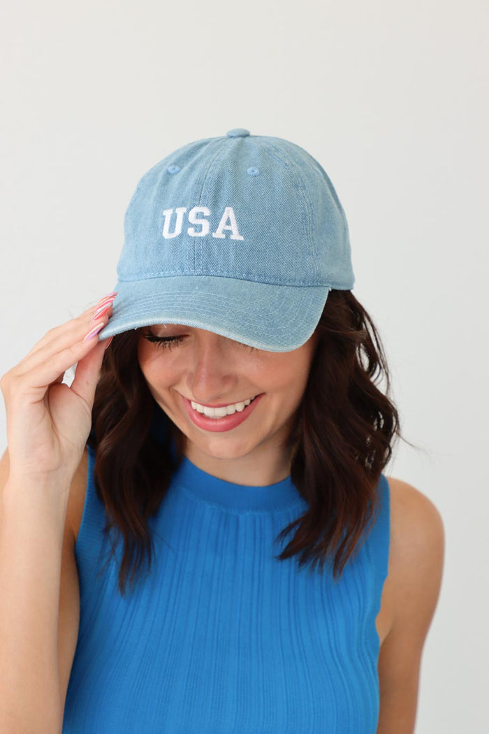 girl wearing light blue chambray hat with "usa" embroidery