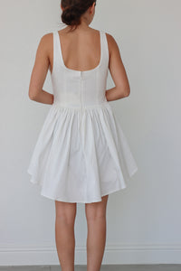 girl wearing white short tank top dress with corset boning