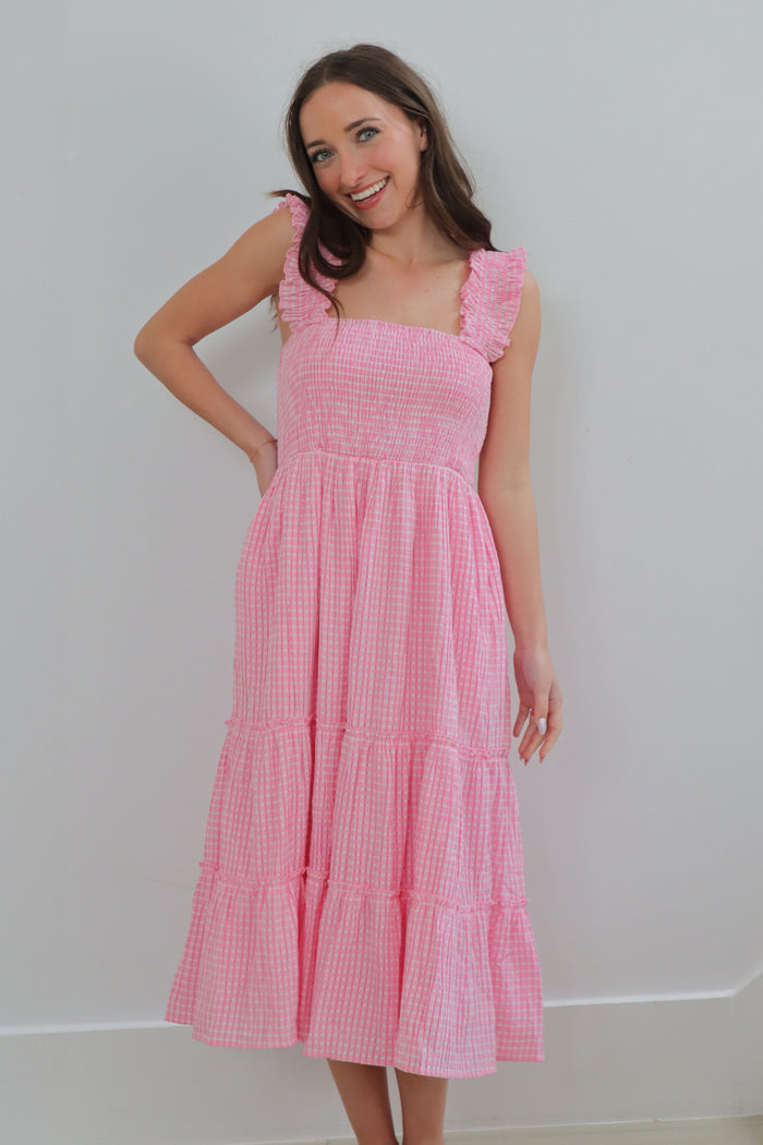 girl wearing pink gingham midi dress