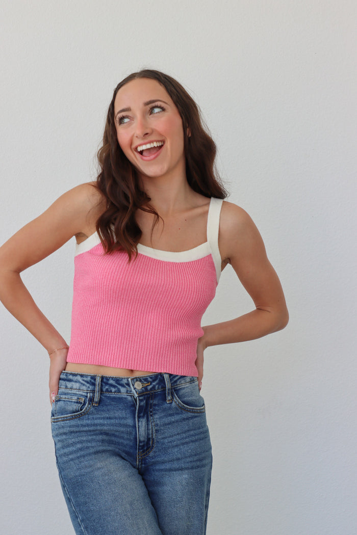 girl wearing pink ribbed tank top with white contrast