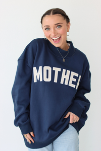 woman wearing navy blue MOTHER sweatshirt