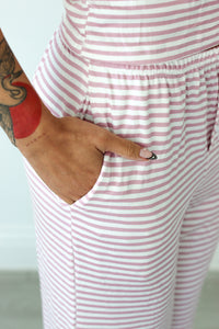 Close up of pink striped pajama pant pockets 