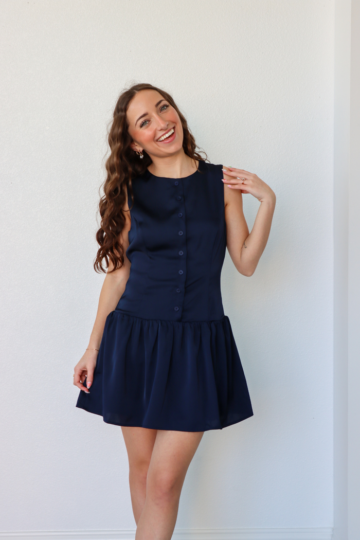 girl wearing navy silk button down dress