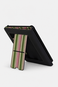A black tablet case with a striped fabric stand, shown standing open on a light gray background.