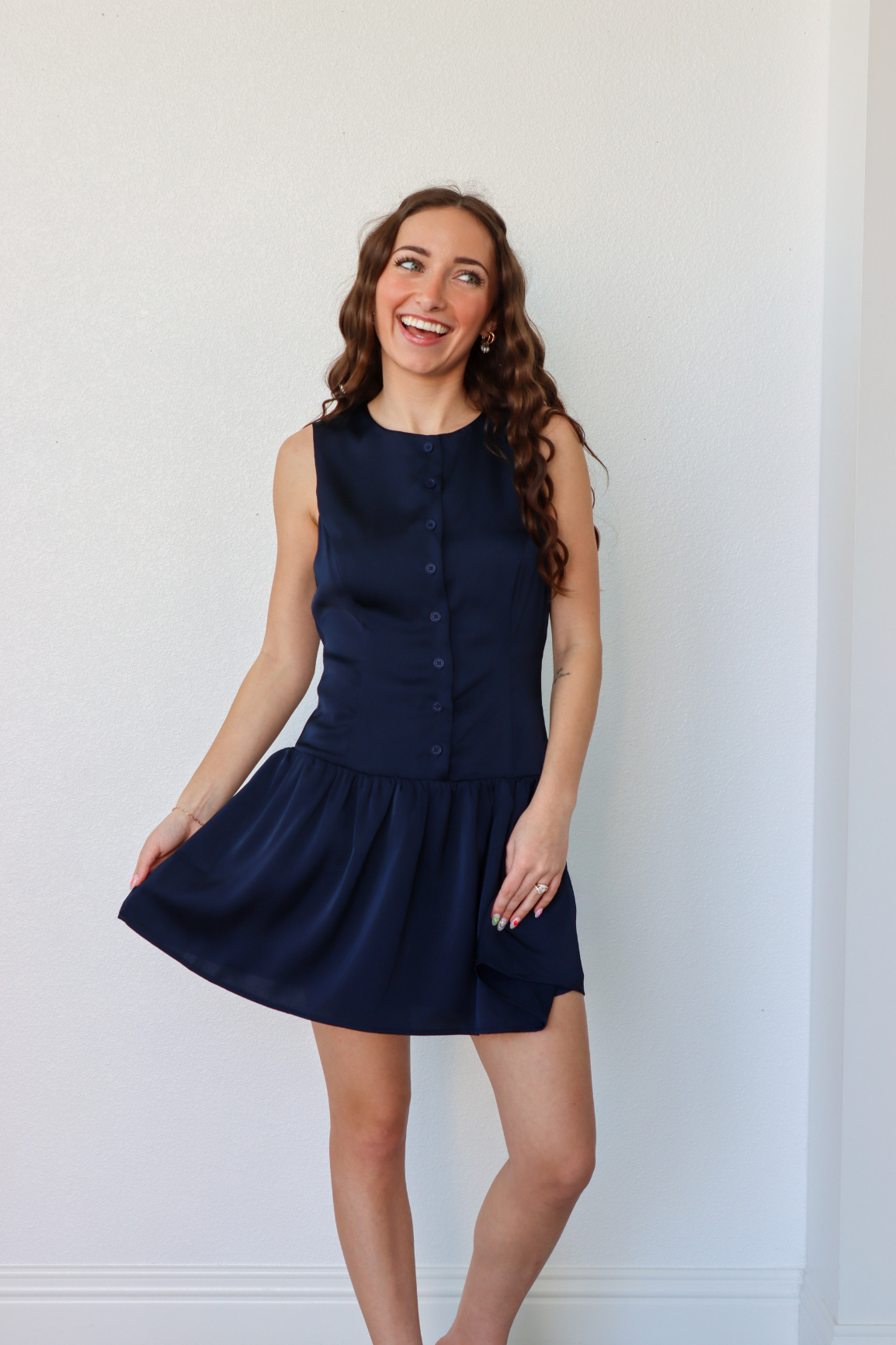 girl wearing navy silk button down dress