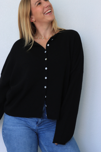 girl wearing black cardigan