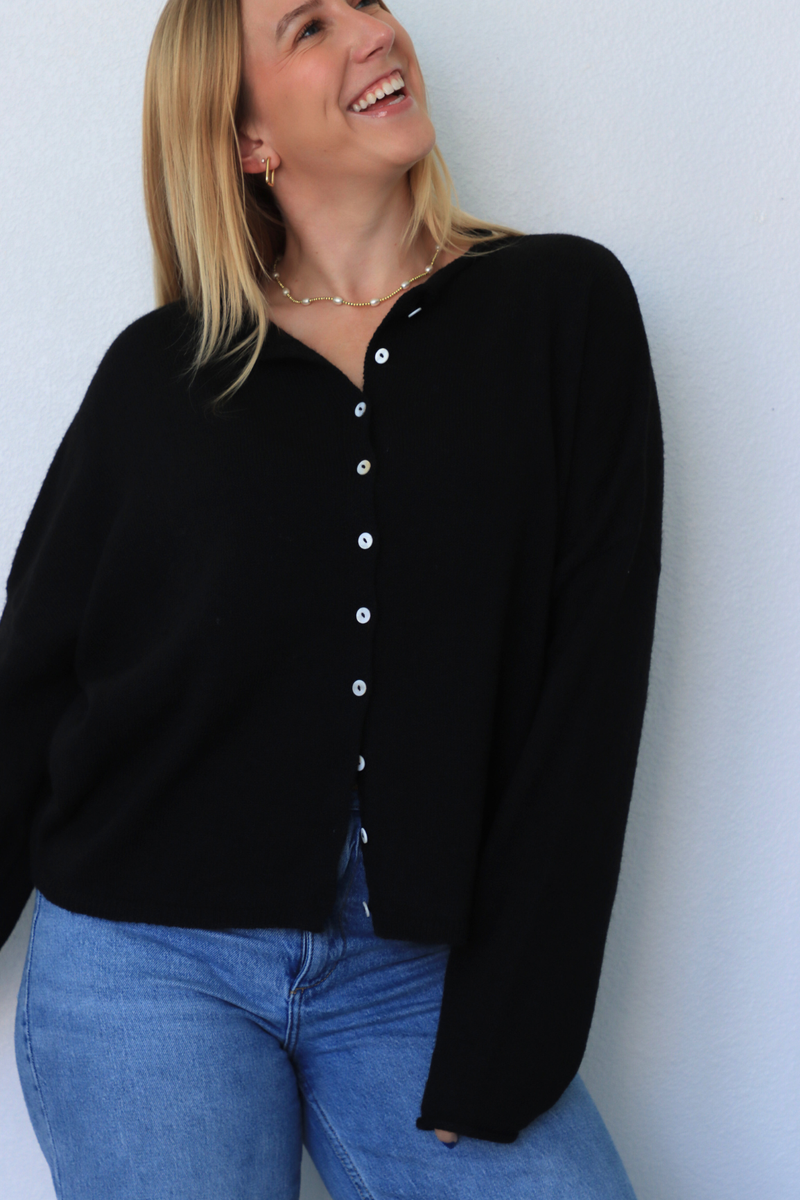 girl wearing black cardigan