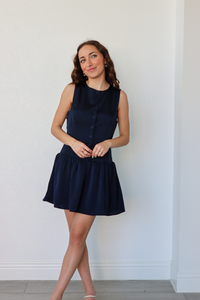 girl wearing navy silk button down dress