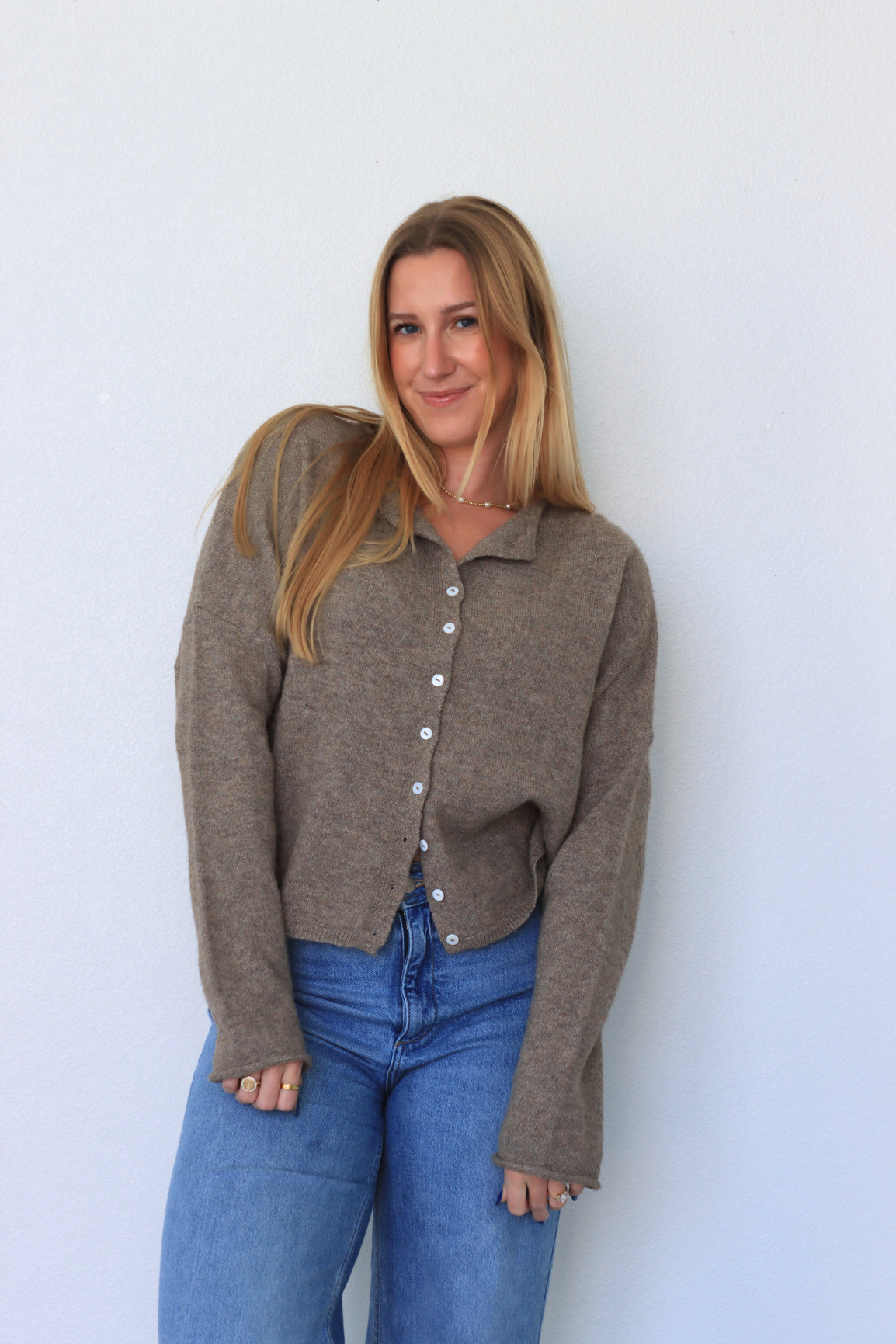 girl wearing brown cardigan