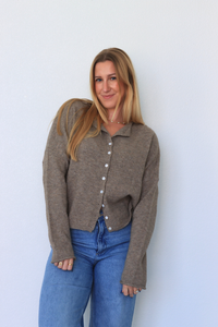 girl wearing brown cardigan