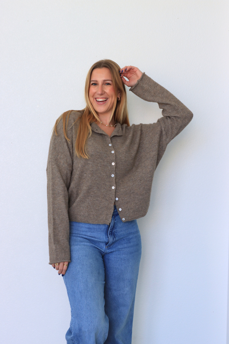 girl wearing brown cardigan