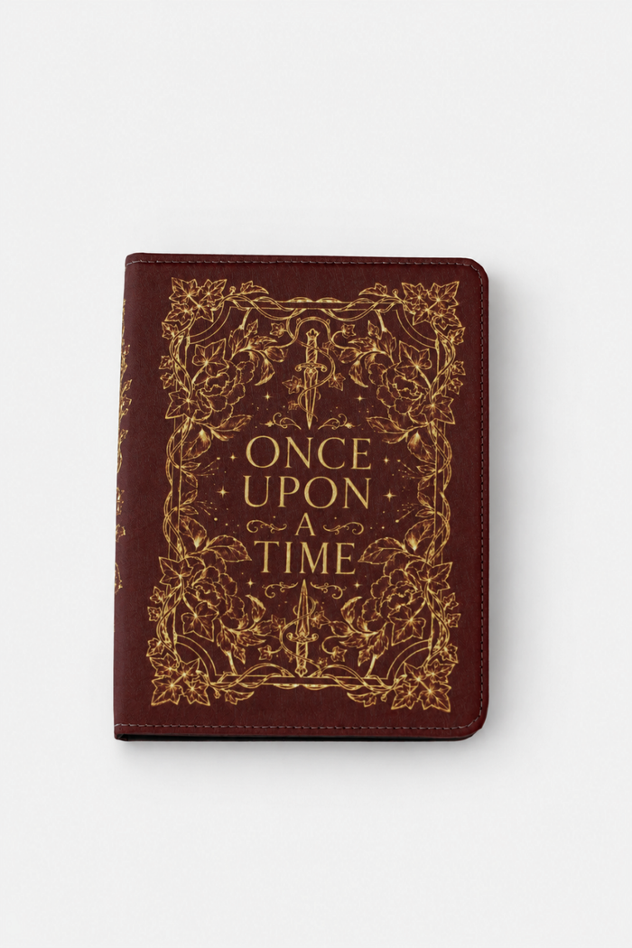 A dark red faux-leather kindle case cover featuring gold foil embossed text reading 'ONCE UPON A TIME' surrounded by an ornate floral border, shown on a white background.
