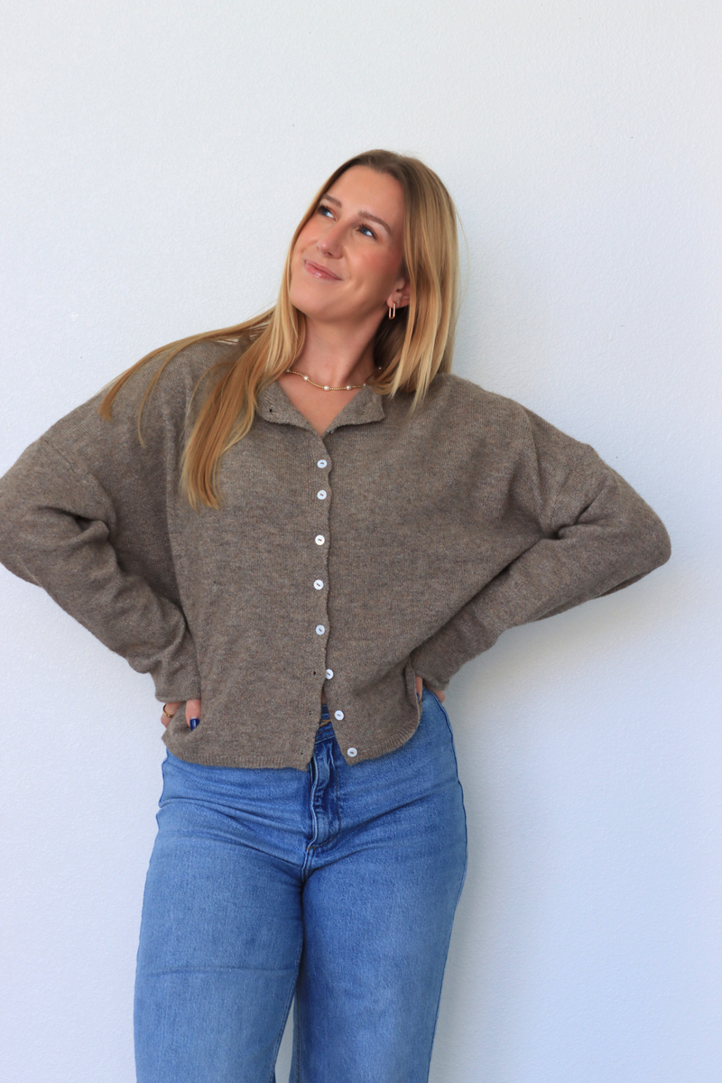 girl wearing brown cardigan