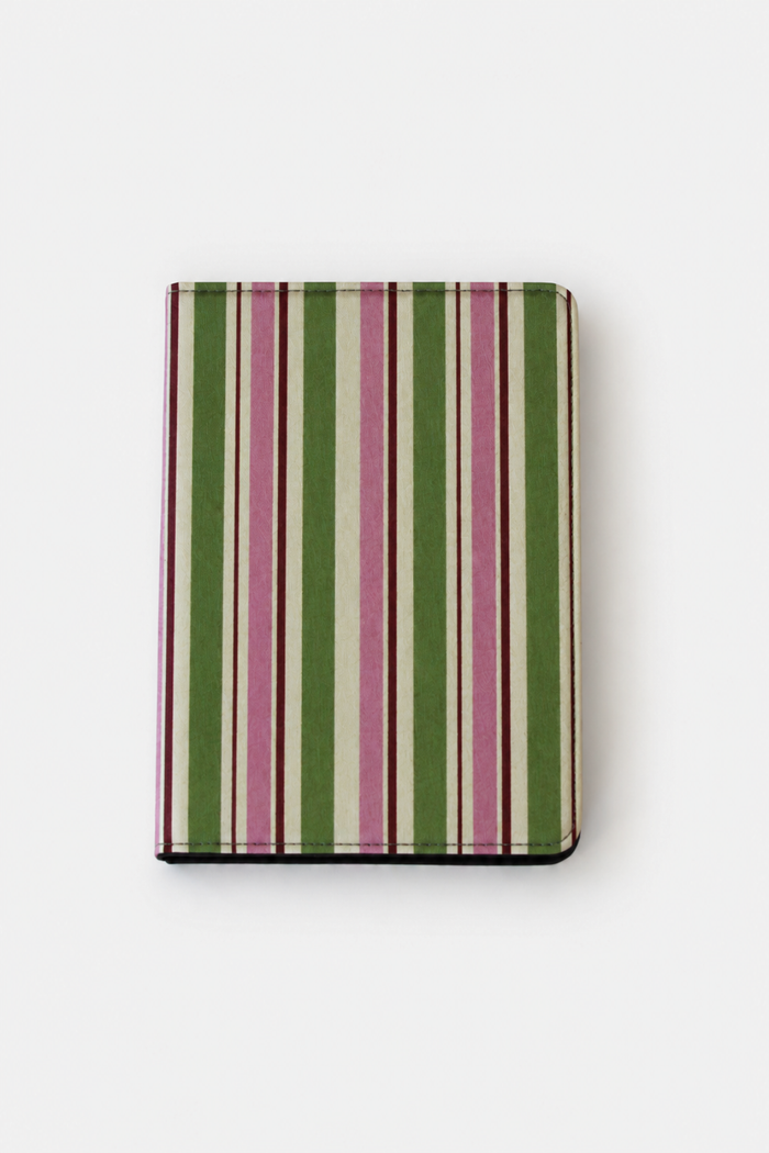 A slim hardcover notebook or journal with a vertical striped pattern in olive green, dusty pink, and cream, shown closed on a clean white background.