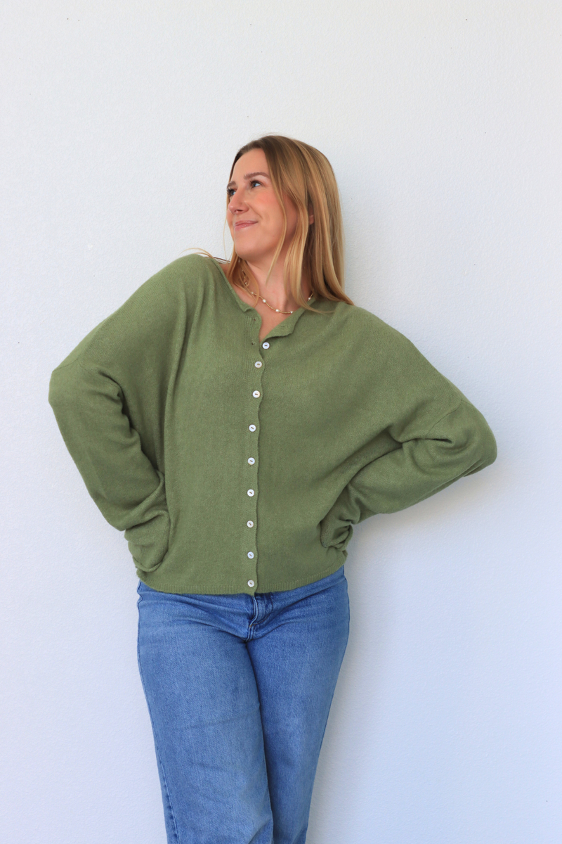girl wearing green cardigan 