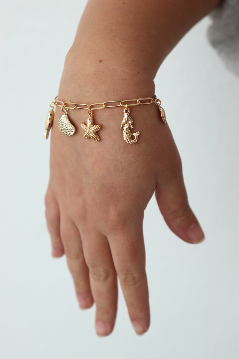 gold charm seashell bracelet