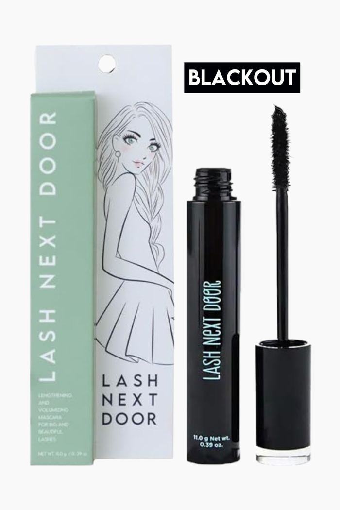 Lash Next Door Blackout eyelash conditioner and mascara shown with its packaging on a white background. The set includes a mint green box, a white hanging card with an illustration, a black tube, and the applicator wand.