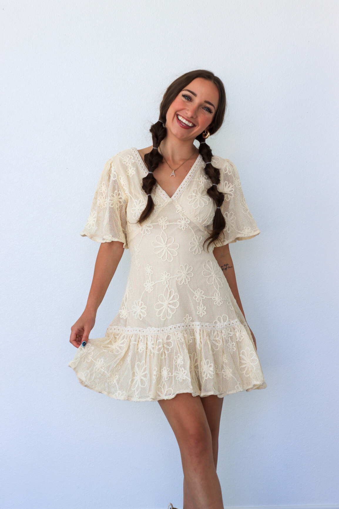 girl wearing cream lace dress