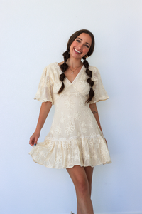 girl wearing cream lace dress