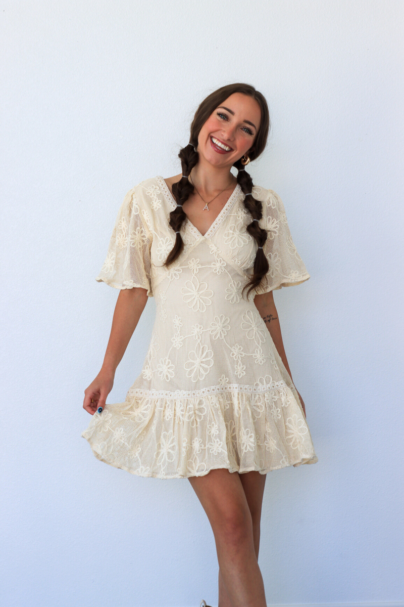 girl wearing cream lace dress