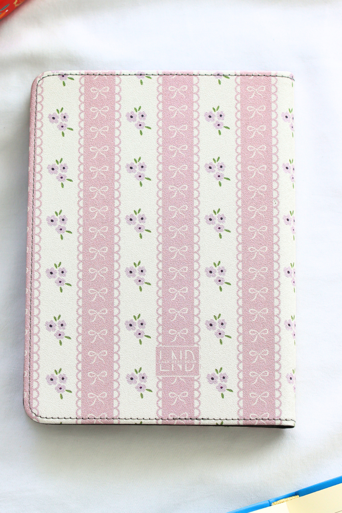 Patterned kindle cover with floral design on a white background