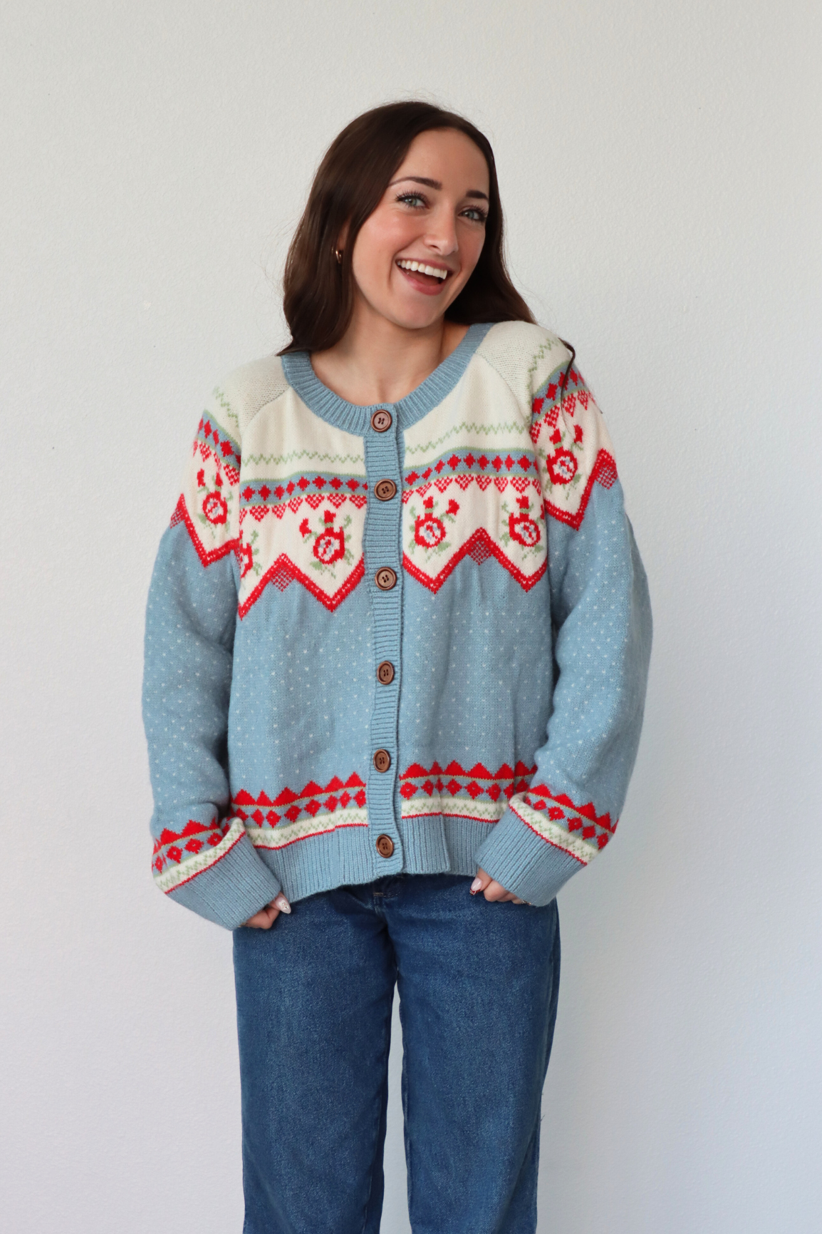 girl wearing light blue knit cardigan