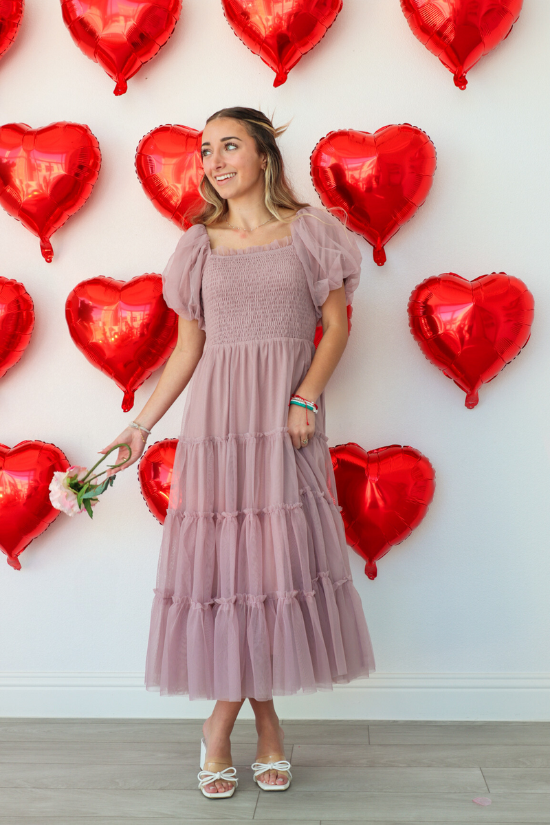 girl wearing mauve long dress with tulle detailing