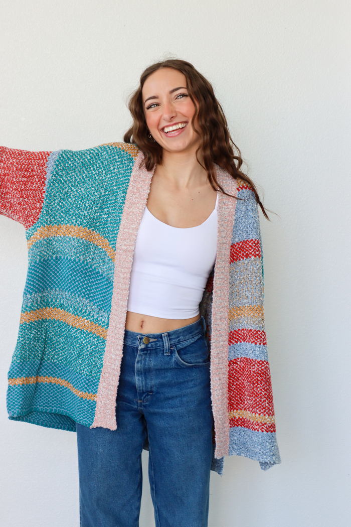 girl wearing multicolor striped cardigan