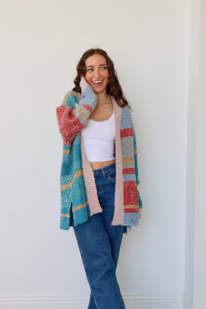 girl wearing multicolor striped cardigan