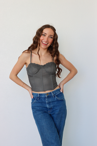 girl wearing gray corset top