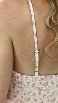 adjustable straps on pink floral dress 