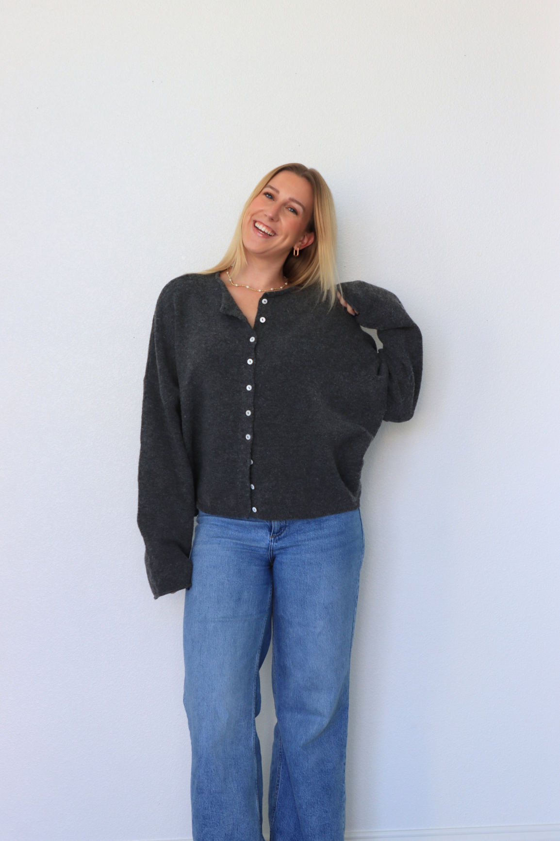 girl wearing dark gray cardigan