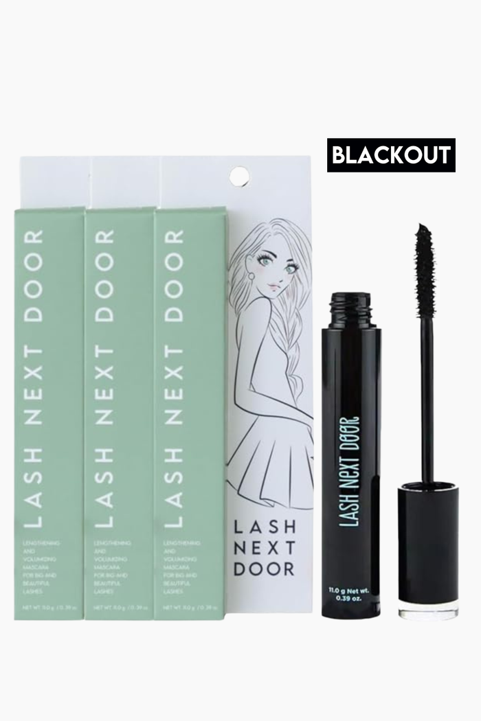 Lash Next Door mascara set featuring four light green boxes, a black tube, and the applicator wand on a white background with a 'BLACKOUT' label.