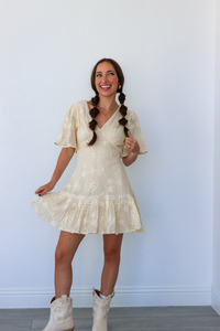 girl wearing cream lace dress