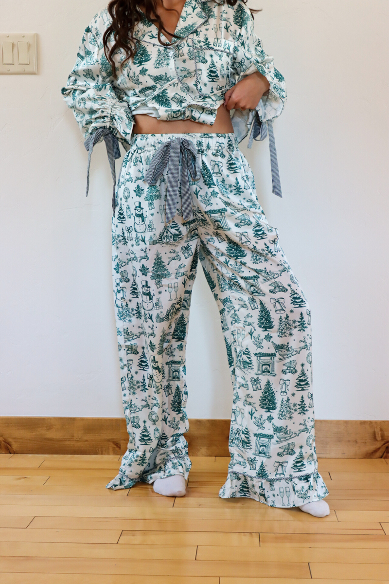 girl wearing white and green toile pajama set