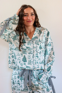girl wearing white and green toile pajama set