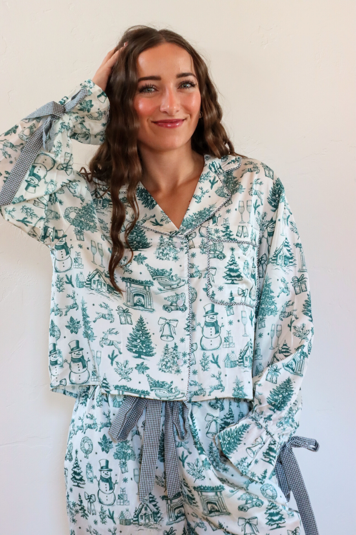 girl wearing white and green toile pajama set
