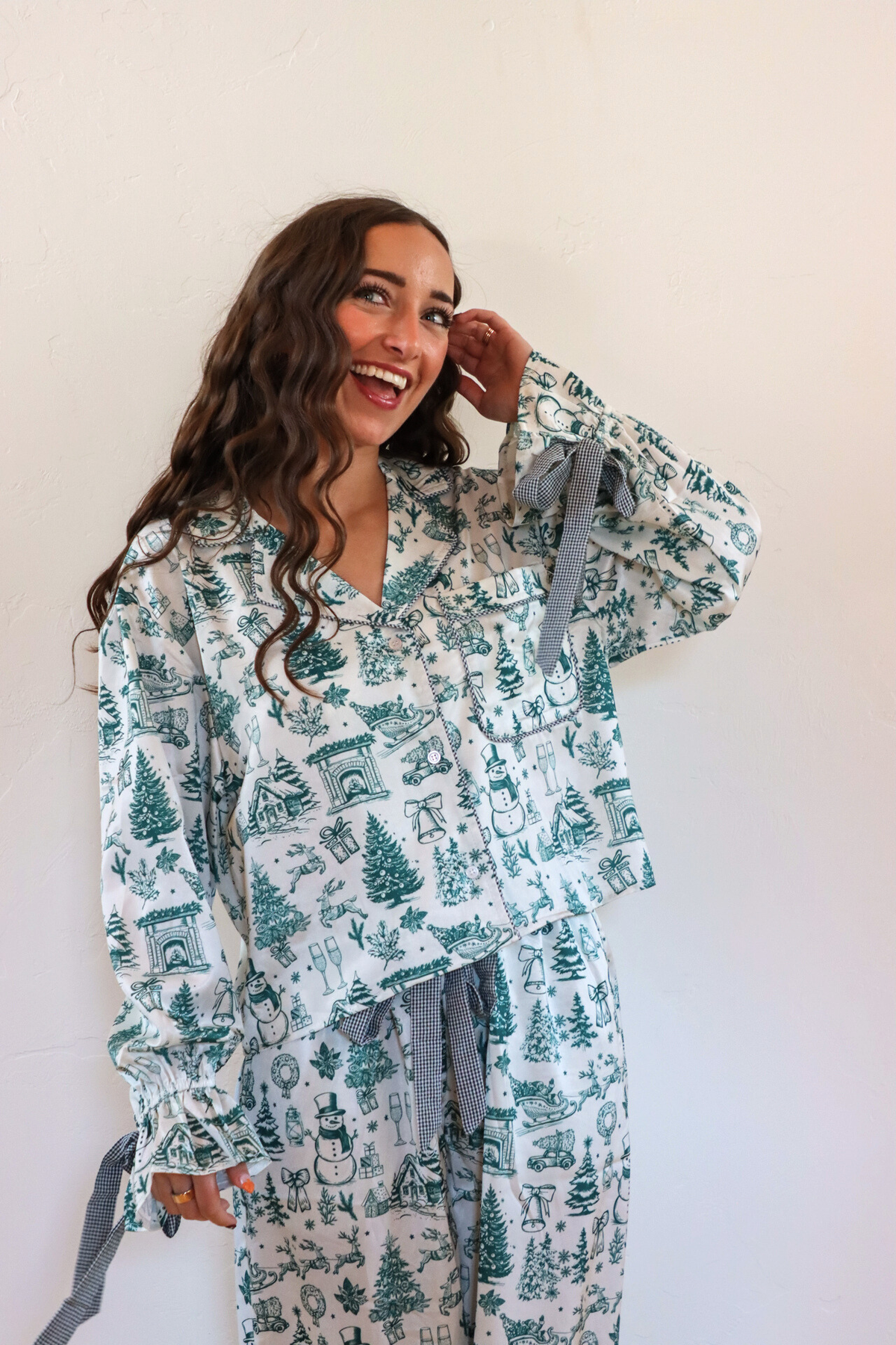 girl wearing white and green toile pajama set