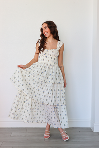 girl wearing white floral long dress