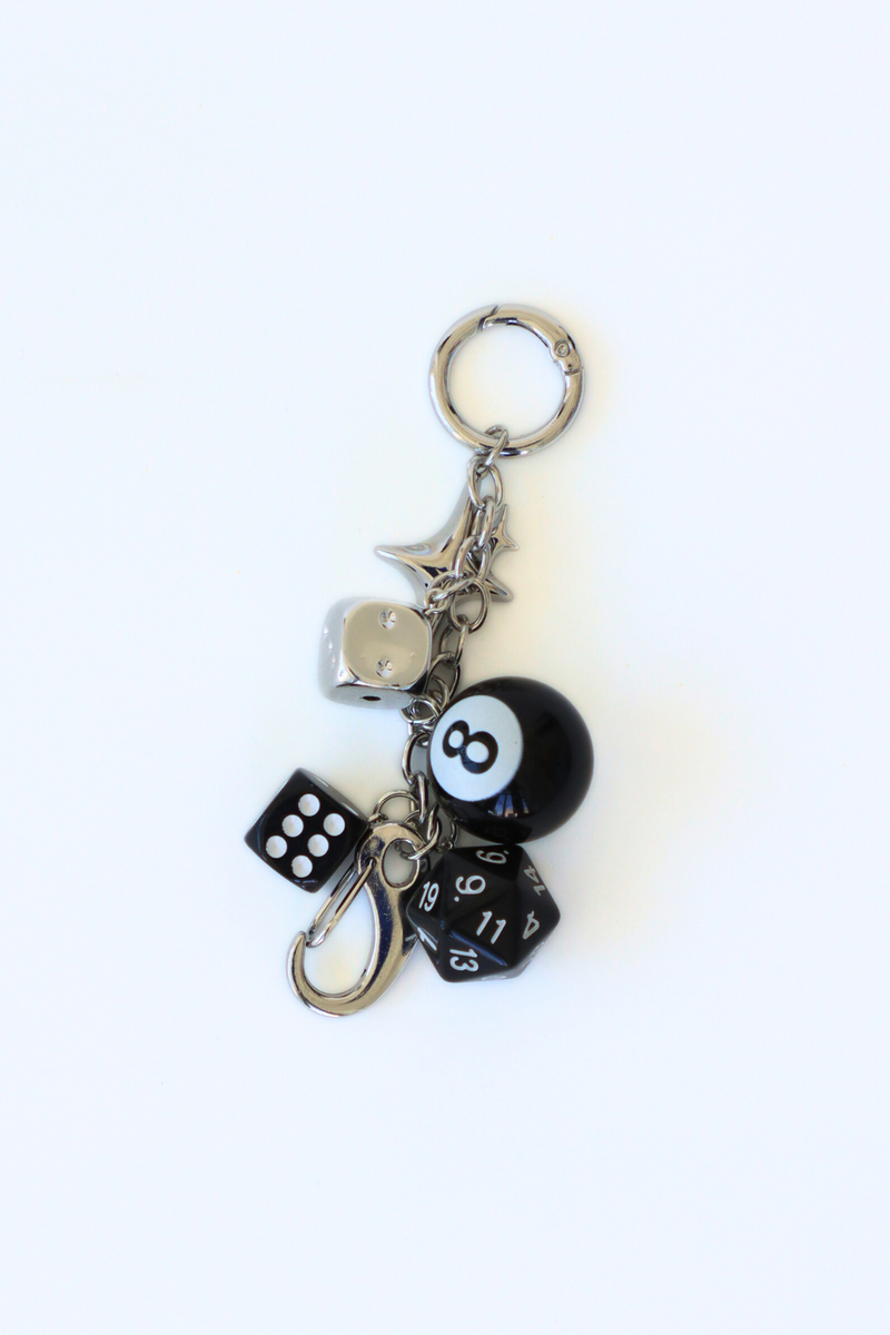 Keychain with dice and ball charms on a white background