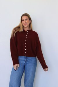 girl wearing dark red cardigan