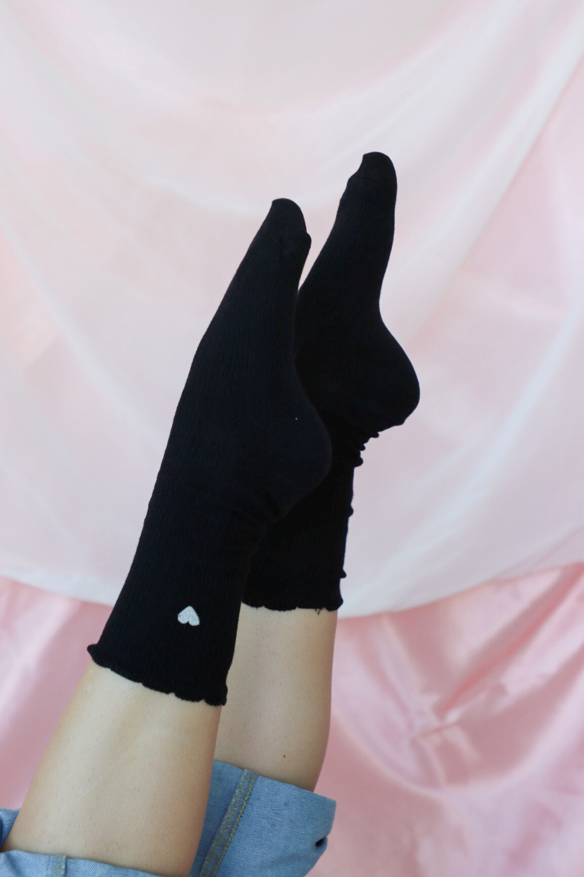 black crew sock with white heart