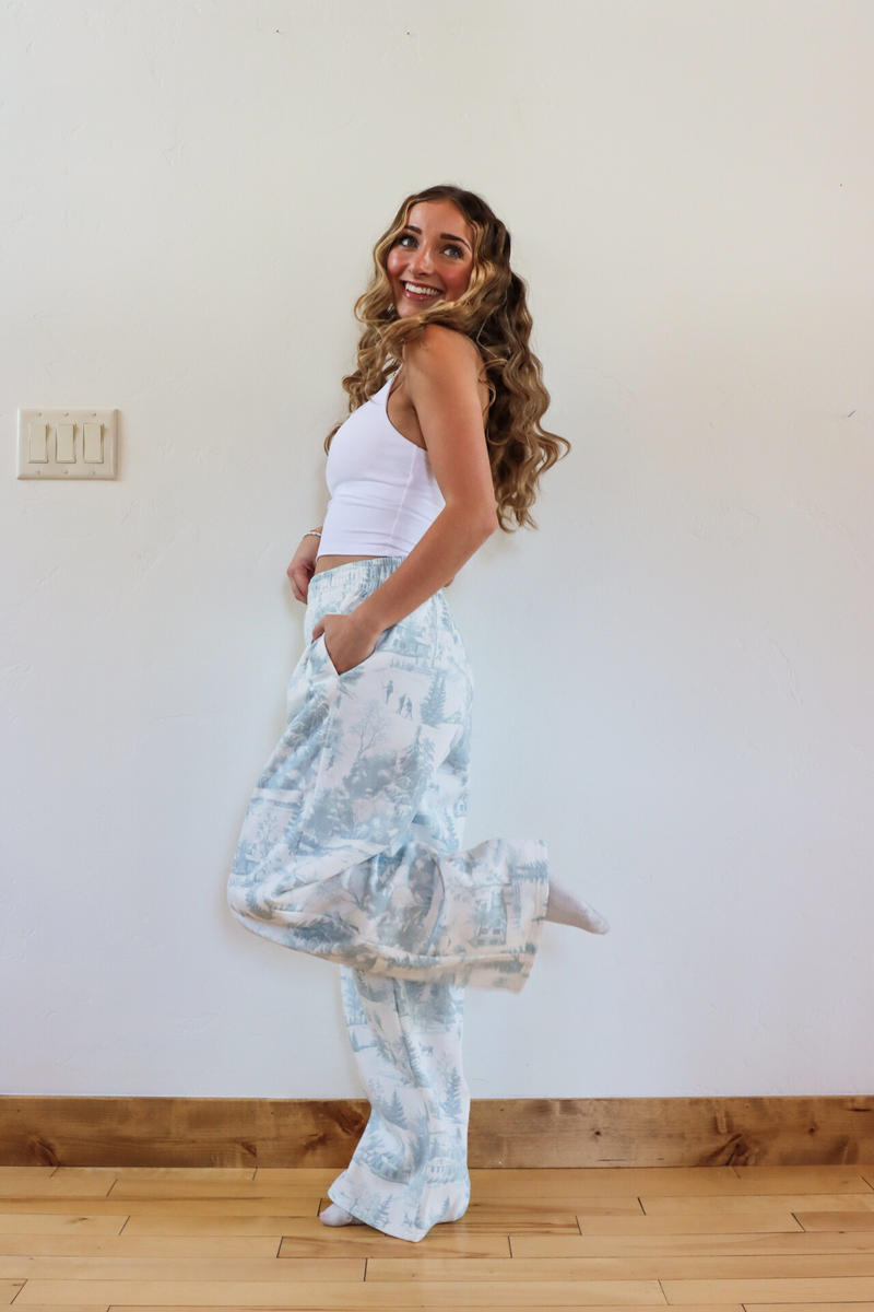 girl wearing toile holiday pajama pants