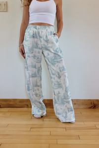 girl wearing toile holiday pajama pants