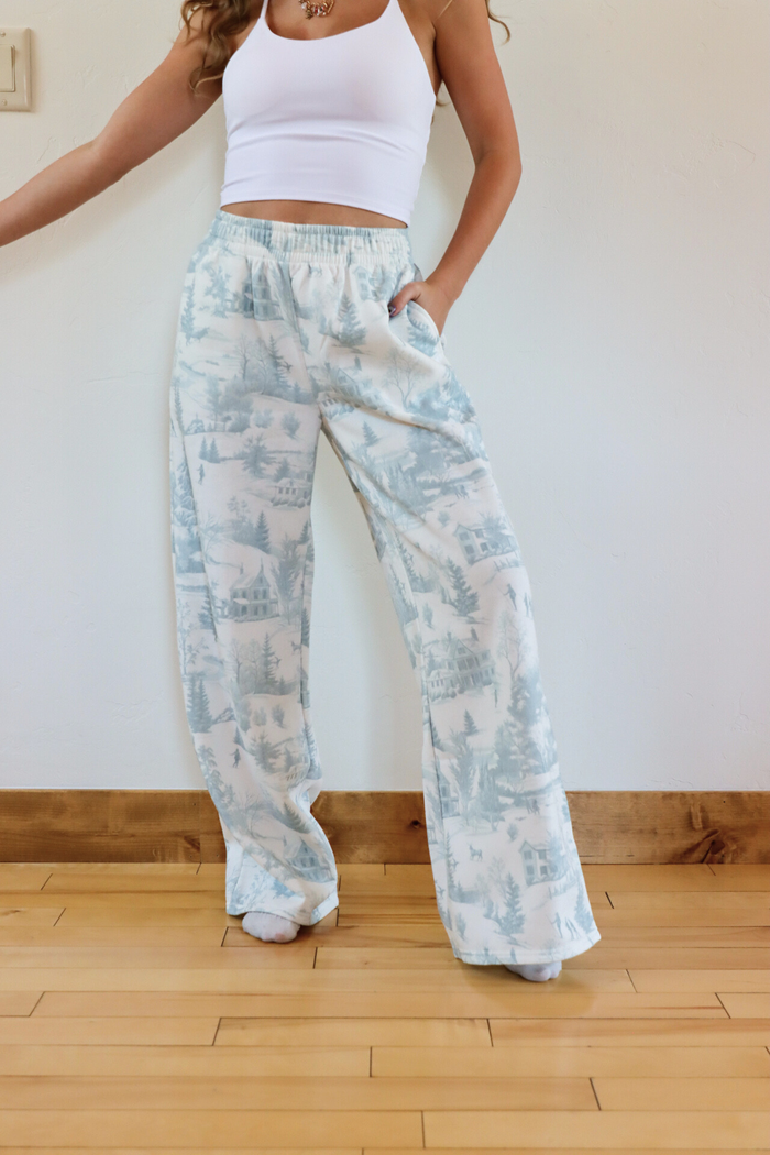girl wearing toile holiday pajama pants
