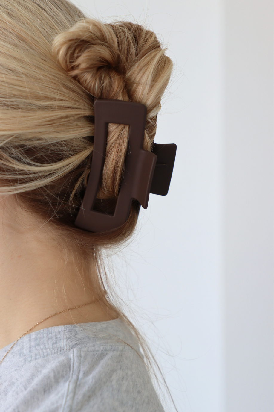girl wearing brown clip in her hair