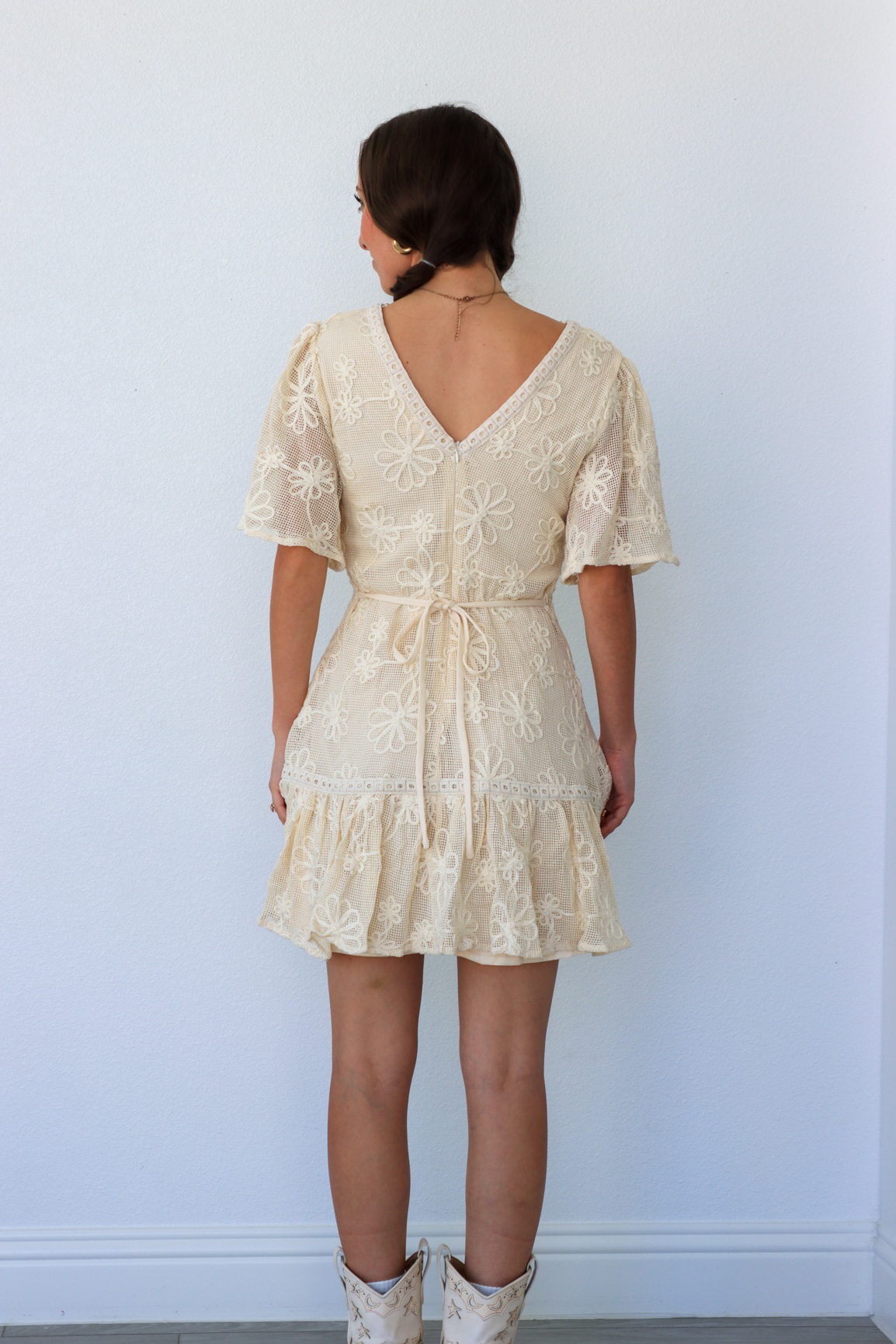 girl wearing cream lace dress